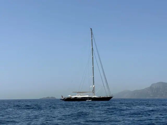 A full shot of the Bayesian on the sea, you can see its full sailing mast