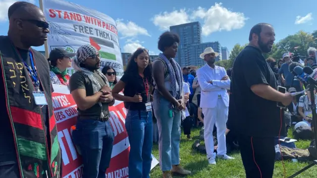 A man speaking at a rally in Chicago