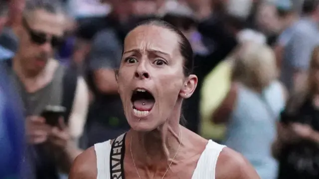 Kelly Wildego is pictured shouting in the street during a demonstration in Whitehall