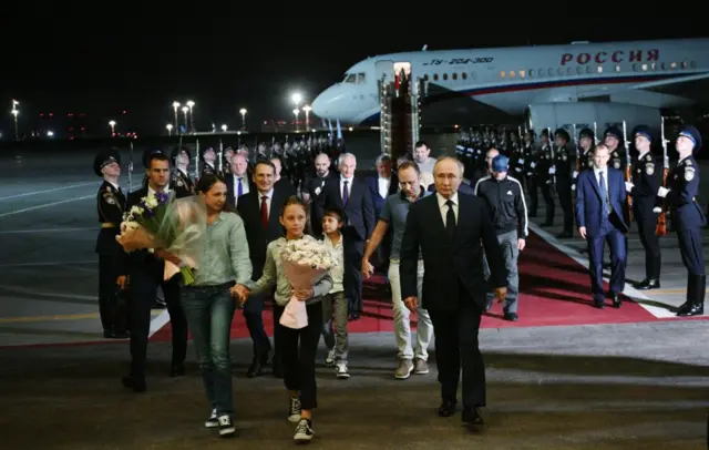 Russian President Vladimir Putin meets Russian citizens released after the Russian-US prisoner swap in Turkiye at Vnukovo International Airport in Moscow