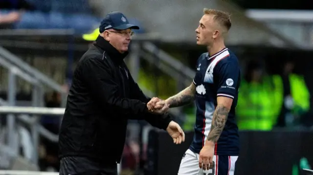 Falkirk manager John McGlynn (L) shakes the hand of Calvin Miller as he is substituted during a William Hill Championship match between Falkirk and Queen's Park at the Falkirk Stadium, on August 02, 2024, in Falkirk, Scotland. (Photo by Mark Scates / SNS Group)