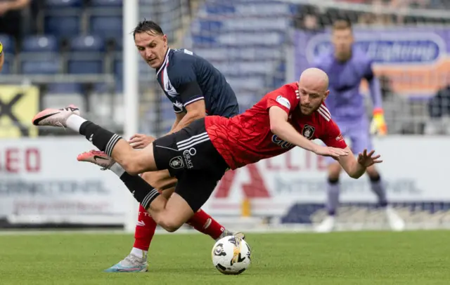 Queen's Park's Zak Rudden (R) and Falkirk's Liam Henderson in action during a William Hill Championship match between Falkirk and Queen's Park at the Falkirk Stadium, on August 02, 2024, in Falkirk, Scotland. (Photo by Mark Scates / SNS Group)