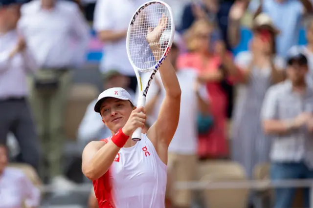 Iga Swiatek of Team Poland celebrates victory during the Tennis Women's Singles Bronze Medal match against Anna Karolina Schmiedlova