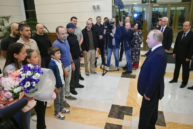 Russian President Vladimir Putin meets Russian citizens released after the Russian-US prisoner swap in Turkiye at Vnukovo International Airport in Moscow