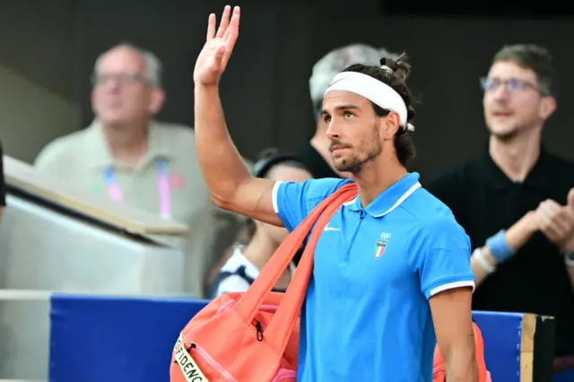 Italy's Lorenzo Musetti arrives to play Serbia's Novak Djokovic