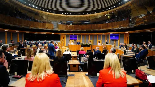 60 Members of the Senedd assemble in the Chamber to install the first minister