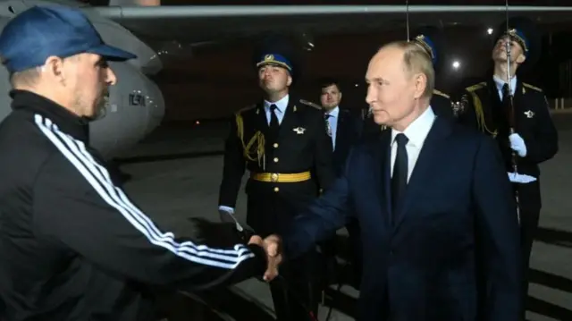 Russian President Vladimir Putin meets Russian citizens released after the Russian-US prisoner swap in Turkiye at Vnukovo International Airport in Moscow