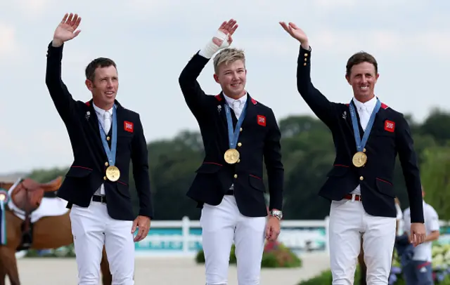 Gold medalists Scott Brash, Harry Charles and Ben Maher of Team Great Britain celebrate