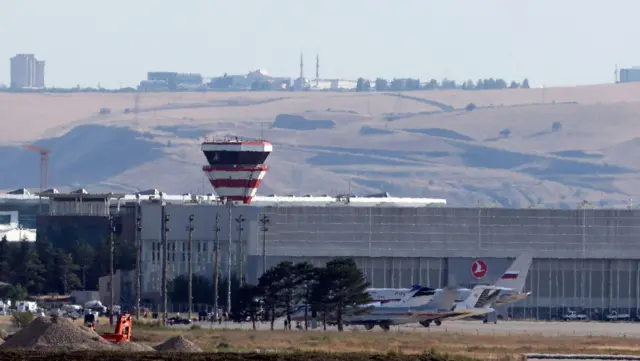 A Russian government plane and private jets is seen at the Esenboga Airport in Ankara, Turkey