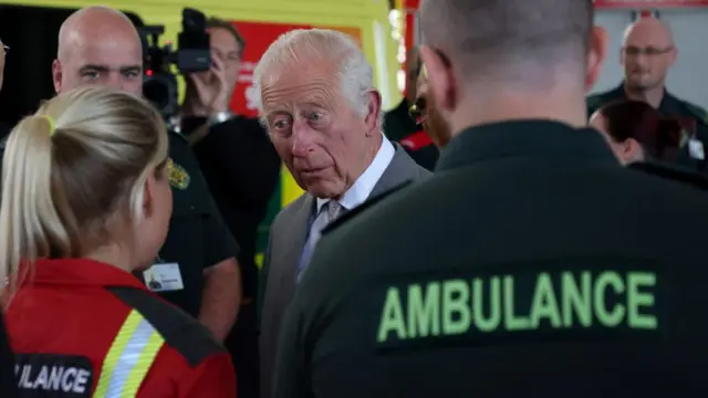 King Charles talking to ambulance workers