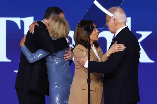 US President Joe Biden, First Lady Jill Biden, Democratic presidential candidate and U.S. Vice President Kamala Harris and Second Gentleman Doug Emhoff greet on stage during Day one of the Democratic National Conve