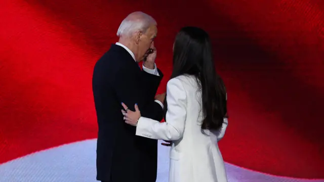 .S. President Joe Biden stands onstage with Ashley Biden during Day 1 of the Democratic National Convention (DNC) at the United Center