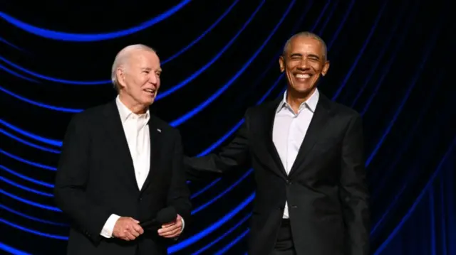 US President Joe Biden (L) laughs with former US President Barack Obama onstage during a campaign fundraiser at the Peacock Theater in Los Angeles on June 15, 2024.