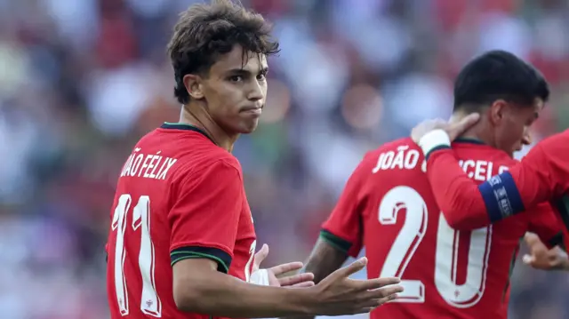 Joao Felix looks over his shoulder while playing for Portugal