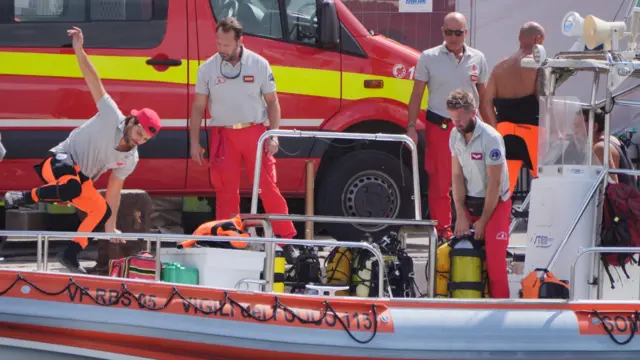 Italian emergency services prepare to head toward the area where the boat sank