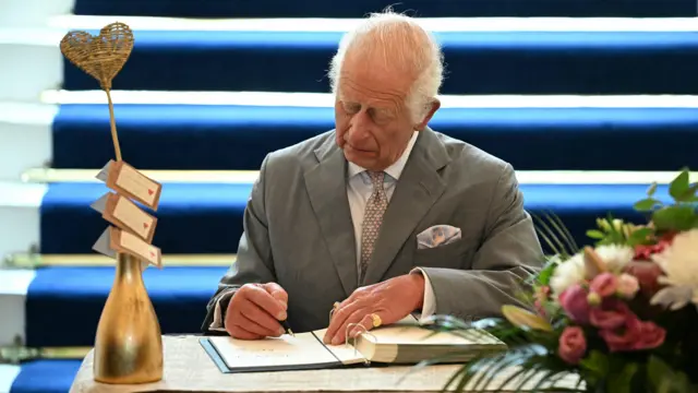 King Charles signs book of condolence for three girls killed