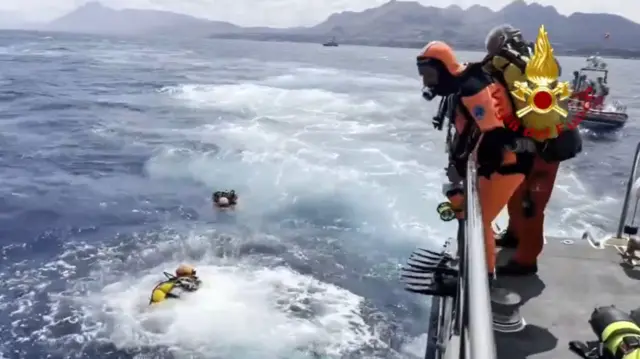 Cave divers from the Italian fire brigade preparing for inspections of the Bayesian yacht's wreck