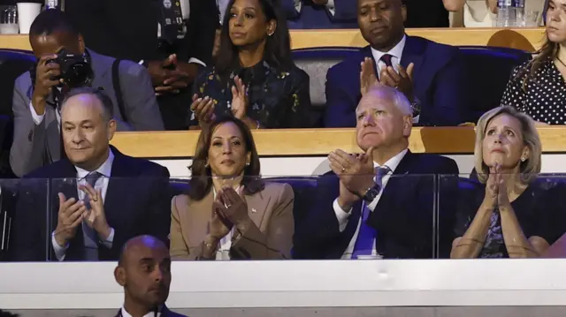 Second Husband Doug Emhoff (L) Vice President Kamala Harris (2L) Minnesota Governor Tim Walz (2R) and Gwen Walz (R) listen to speeches on the opening night of the Democratic National Convention (DNC)