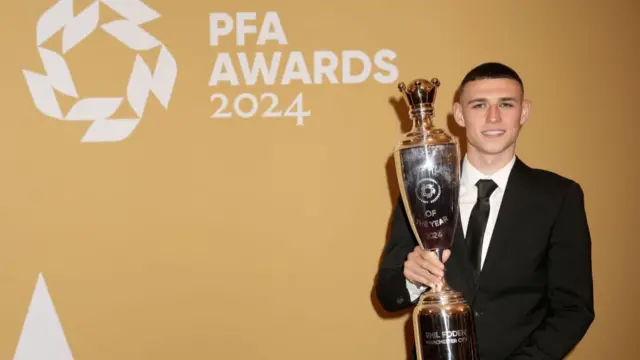 Phil Foden with the Players Player of the Year award during the PFA Awards 2024 at Manchester Opera House on August 20, 2024 in Manchester, England.