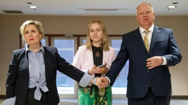 The Walz's seen with their daughter, Hope, in 2022