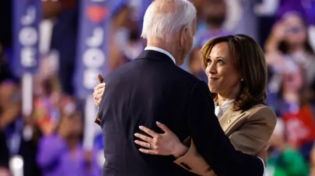 Kamala Harris embraces Joe Biden after his speech