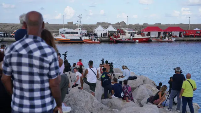 Crowds watching on from across the harbour