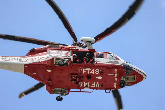 A fire brigade helicopter seen from below