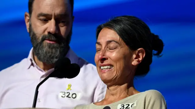 Rachel Goldberg, mother of Hersh Goldberg-Polin who is being held hostage in Gaza, reacts next to her husband Jon Polin as they take the stage on Day 3 of the Democratic National Convention (DNC) in Chicago, Illinois, U.S., August 21, 2024.