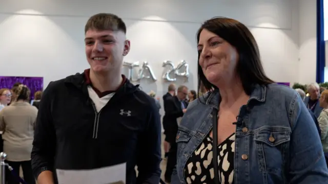 Lewis and his mother Lisa smiling