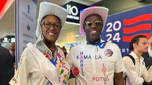 Karen Kenyatta Russell (pictured left)  poses for a photo at the DNC