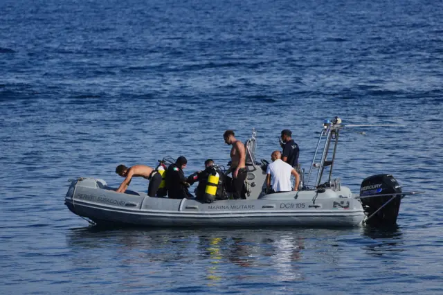 Dive crew in a Marina Militare boat preparing for a dive off the port of Porticello in the Bayesian yacht search