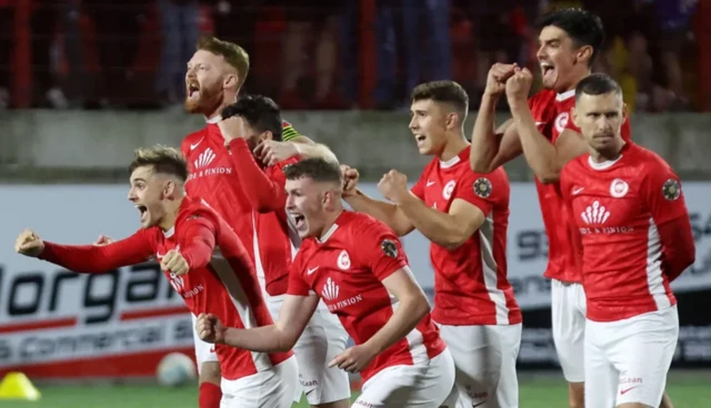 Larne players celebrate