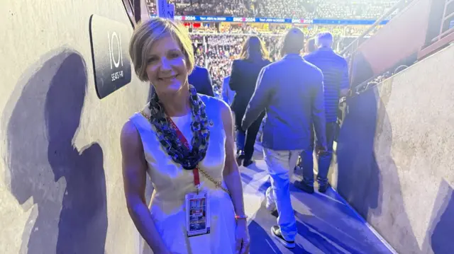 A woman standing in an arena