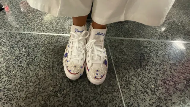 White Chuck Taylor sneakers customized for Kamala Harris