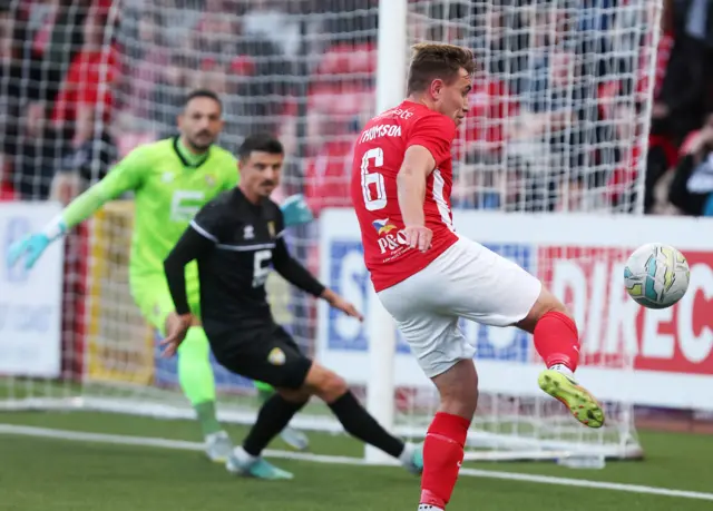 Larne's Joe Thomson on the attack against Ballkani in the third qualifying round