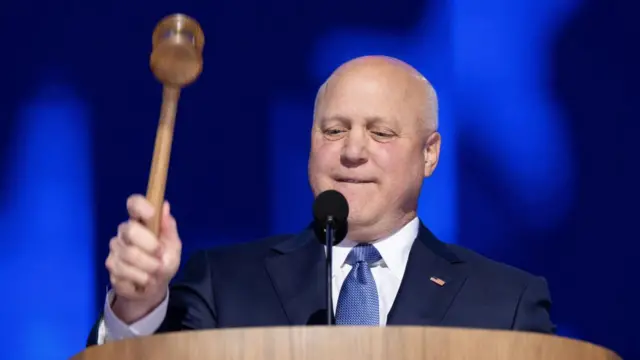 Senior Advisor to the US President for Infrastructure Coordination Mitch Landrieu, bangs the gavel to commence the second night of the Democratic National Convention (DNC) at the United Center in Chicago, Illinois, USA, 20 August 2024.