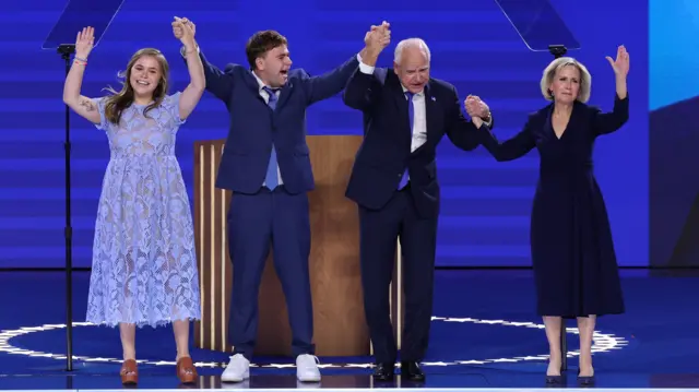 Gov. Walz and his family join him on stage after his speech