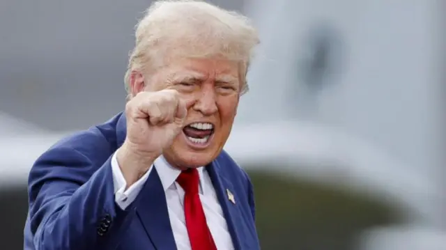 Republican presidential nominee and former U.S. President Donald Trump gestures during a campaign rally, at the North Carolina Aviation Museum & Hall of Fame in Asheboro, North Carolina, U.S. August 21, 2024.