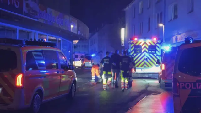 Police and ambulances stand near the scene where a several people died and several were injured in an attack on late August 23, 2024 in Solingen, western Germany, according to German media, as the city celebrated its 650th anniversary.