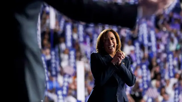 Democratic presidential nominee and U.S. Vice President Kamala Harris reacts