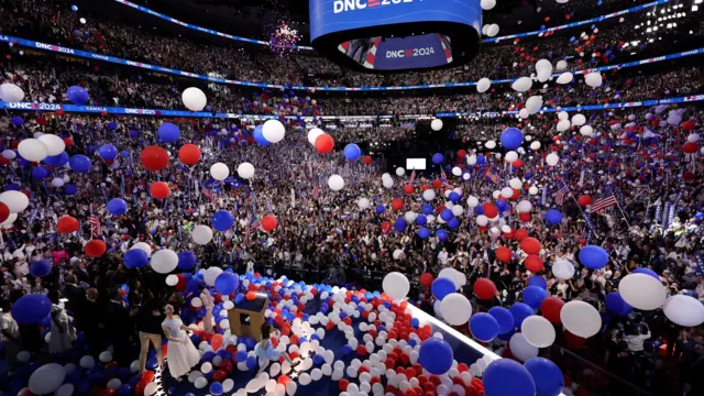 The balloons covered the crowd as others joined Harris on stage at the DNC