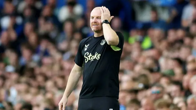 Sean Dyche, Manager of Everton, reacts after Ashley Young of Everton (not pictured) receives a red card during the Premier League match between Everton FC and Brighton & Hove Albion FC at Goodison Park on August 17, 2024 in Liverpool, England.