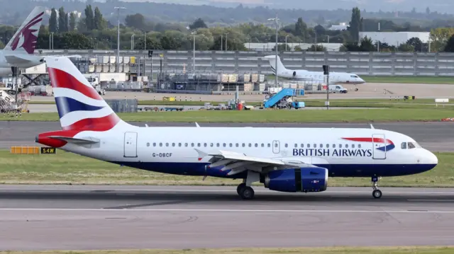 A British Airways plane taxis at Heathrow Airport.