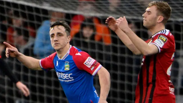 Linfield's Joel Cooper and Daniel Larmour of Crusaders