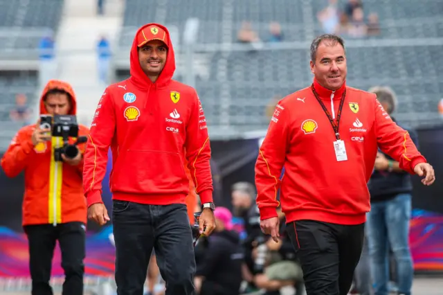 Carlos Sainz walks in the paddock at Zandvoort