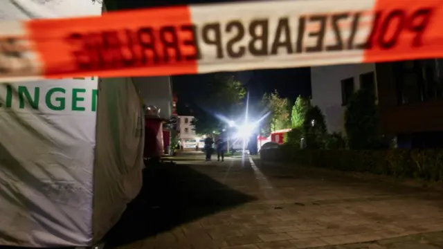 Police tape is set up following an incident in which several individuals were killed on Friday night when a man randomly stabbed passers-by with a knife at a city festival, in Solingen