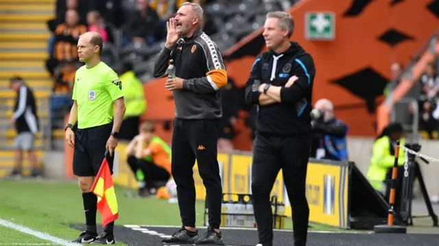 Tim Walter and Neil Harris on the touchline