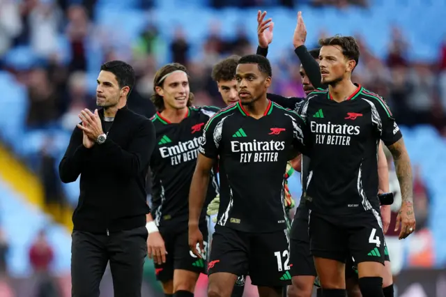 Arteta and his side clap the fans at full time