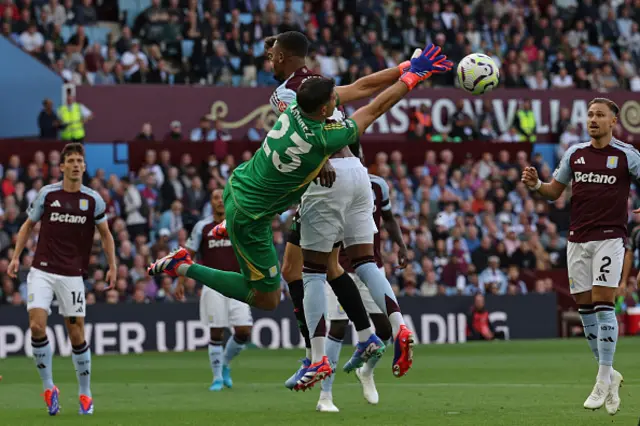 Emiliano Martinez punches the ball