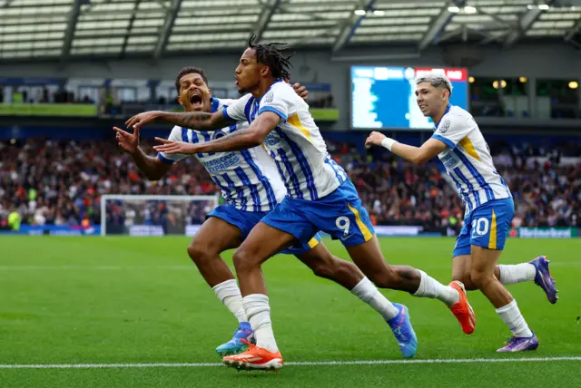 Brighton run to celebrate with Pedro after his winning goal